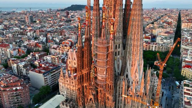 Sagrada Familia at sunrise in Barcelona, aerial close up view of Sagrada familia cathedral in Barcelona, Spain, famous landmark in Barcelona by Antonio Gaudi