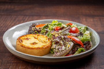 Quiche with lettuce and tomato salad. Healthy food.