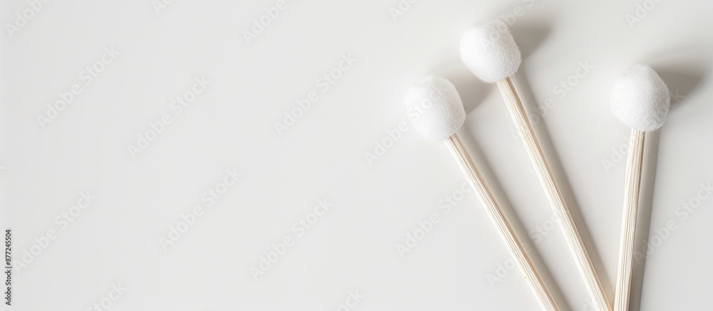 Poster cotton buds for ear cleaning displayed on a white backdrop with copy space image