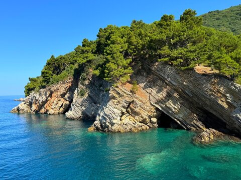 Unusual rock formations in turquoise Adriatic sea Montenegro