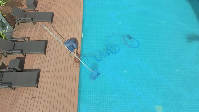 Pool maintenance with automatic robot. cleaner the bottom of the pool.