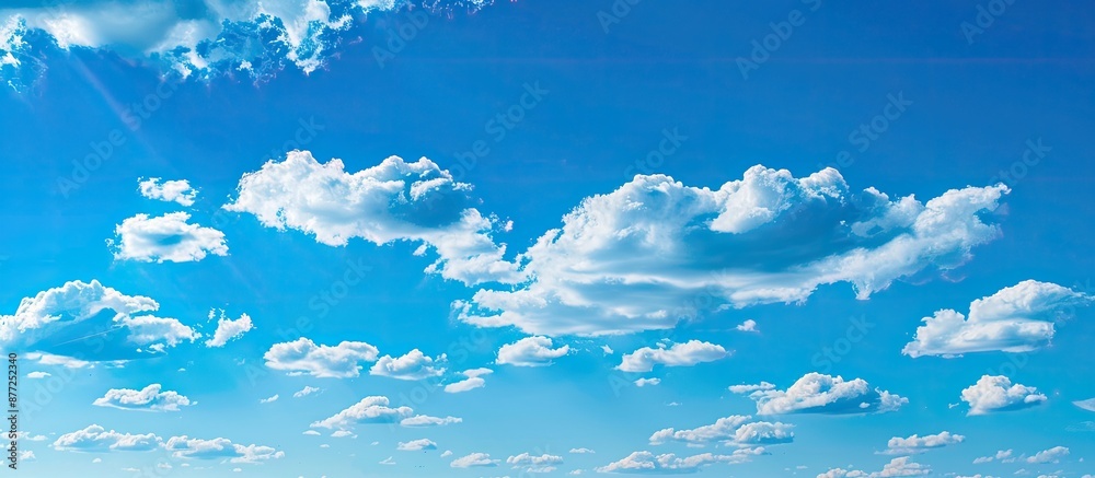 Poster beautiful nature scene featuring clouds floating in a blue sky with serene beauty ideal as a copy sp