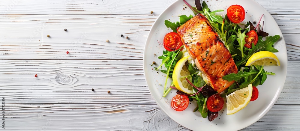 Poster salmon dish with salad and lemon garnish on a white wooden backdrop perfect for a copy space image