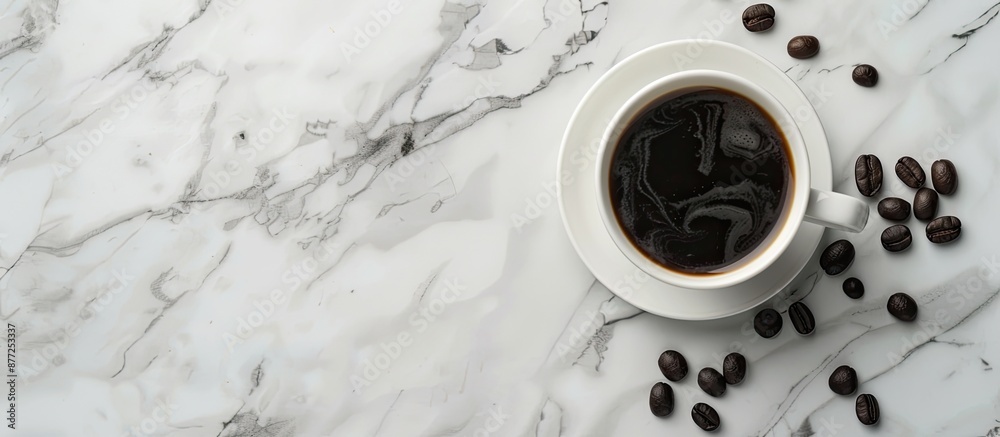 Poster a cup of black coffee and coffee beans displayed on a marble table suggesting a breakfast or nightti
