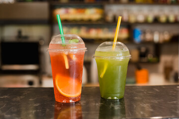two cocktails with ice on the table. nonalcoholic drinks