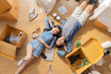 happiness asian lover couple lying on your lap postive conversation taking a break between home relocation home moving in to new house happiness casual house renovation, asian couple lying on floor