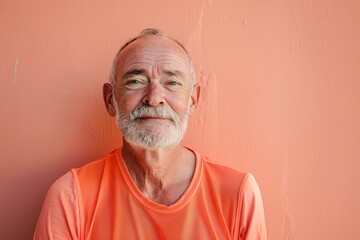 Obraz premium Portrait of a content caucasian man in his 60s sporting a breathable mesh jersey isolated on solid pastel color wall