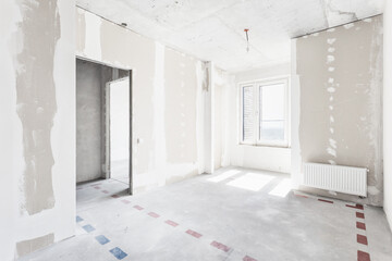 interior of the apartment without decoration in gray colors. rough finish