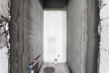 interior of the apartment without decoration in gray colors. rough finish