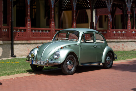 Classic 1960s Volkswagen Beetle in turquoise pearl green metallic color is parking in  Palic, Serbia, 30.06.2024