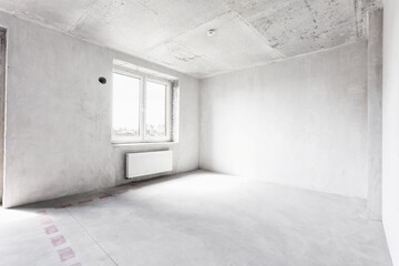 interior of the apartment without decoration in gray colors. rough finish