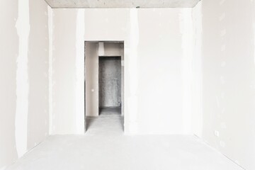 interior of the apartment without decoration in gray colors. rough finish