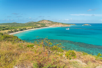 Picturesque tropical sandy Watsons Beach with turquoise water on Lizard Island, Australia. Lizard Island  is located on Great Barrier Reef in north-east part of Queensland.