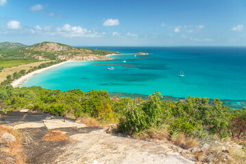 Picturesque tropical sandy Watsons Beach with turquoise water on Lizard Island, Australia. Lizard Island  is located on Great Barrier Reef in north-east part of Queensland.
