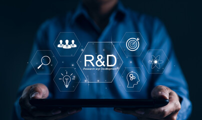 Research and Development, R and D innovation concept. A person holds a tablet displaying virtual...