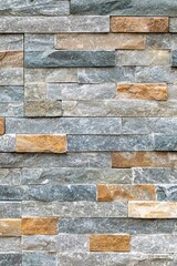 Multi-colored stone wall, showcasing the texture and detail of the masonry work.