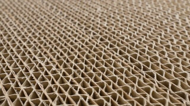 Stack of corrugated cardboard carton side view. Folded carton cross section, close-up view