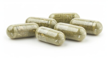 Pressed herbal capsule on a white background