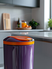 Modern purple and orange trash can in a sleek kitchen.