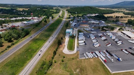 Shipping goods across American with Trucks parked in rest stop on Interstate Highway 