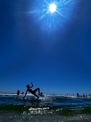 Boy play with the sun