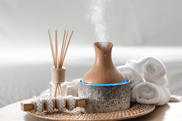 Essential oil aroma diffuser humidifier diffusing water articles in the air.
