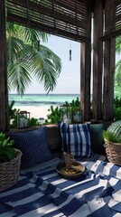 Fototapeta premium A relaxing patio with blue and white striped pillows and a blanket overlooking a tropical beach