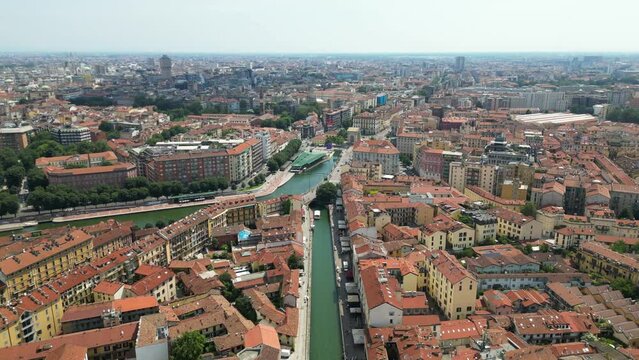 Europe, Italy, Milan drone aerial view of Darsena and Navigli canals waterway in a sunny summer day - Navigli are a tourist destination attraction sightseeing in downtown of the city - new skyline 