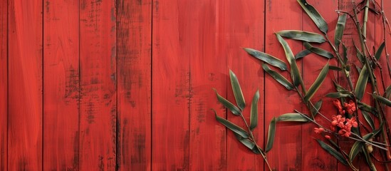 Floral bamboo banner on a textured red wooden backdrop with copy space image