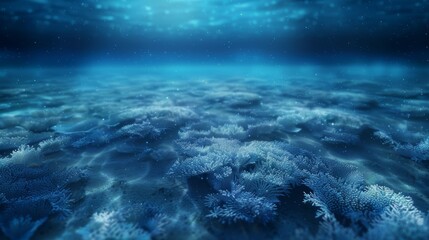 Obraz premium An underwater scene with a vast expanse of blue water and a rocky seabed. Sunlight filters through the surface, illuminating the scene.