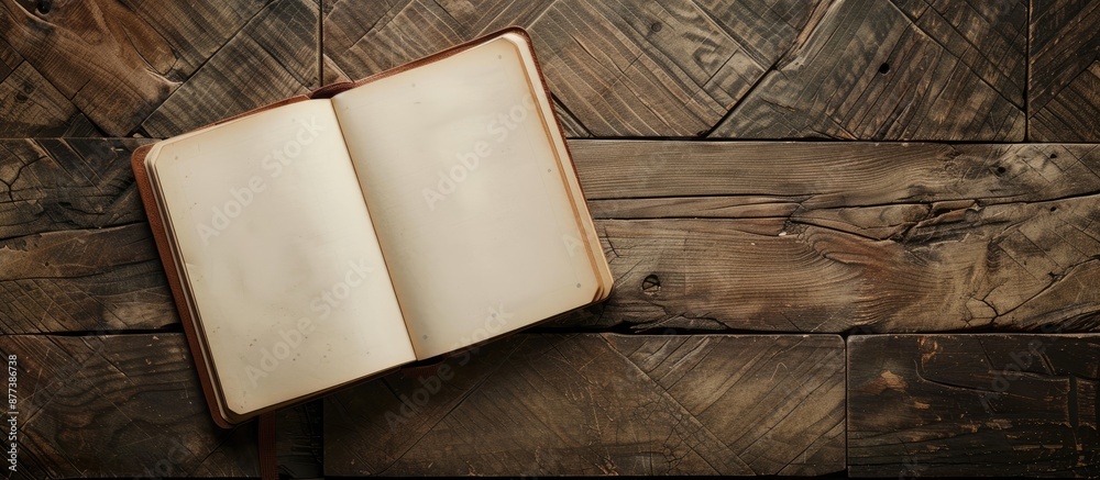 Poster wooden textured surface with a blank notebook creating a copy space image