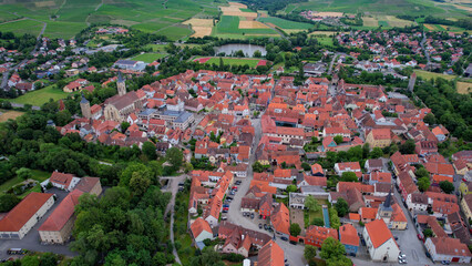 Aerial view of the old town of Iphofen in Germany, on a cloudy day in late spring.