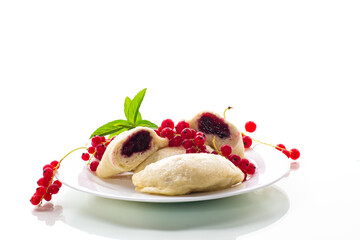 steamed sweet homemade dumplings with berries, red currants