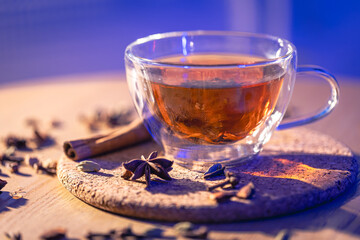 Fragrant black tea with spices on the table, close-up.