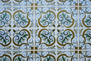 Traditional ornate portuguese decorative tiles. Gold and blue azulejos