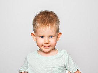 Emotional child on a light background