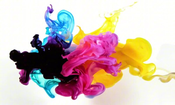 color splashes of ink in cyan magenta yellow black as symbol for subtractive CMYK color blending