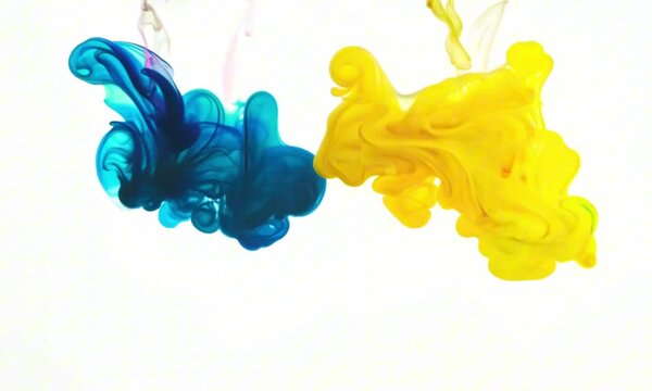 color splashes of ink in cyan magenta yellow black as symbol for subtractive CMYK color blending