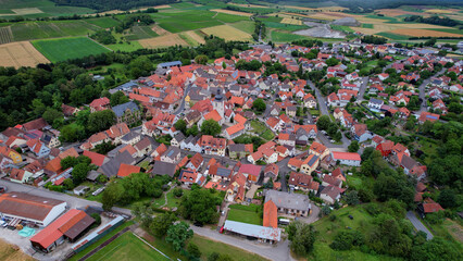 Aerial panorama view around the old town of Markt Einersheim on an overcast summer day in Germany.