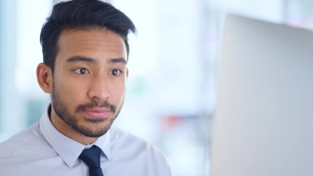 Focused lawyer sipping a cappuccino while working on a case for his upcoming legal trial. Closeup of the face and head of a young male advocate researching the law on his computer while preparing