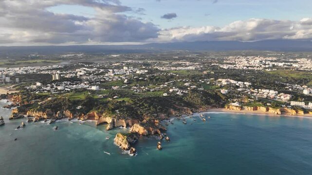 Beautiful view of the Portuguese coastline at sunset. Alvor village, Algarve