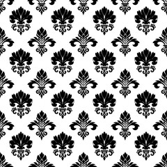 Damask seamless floral pattern. Royal wallpaper. Flowers on a black and white background.