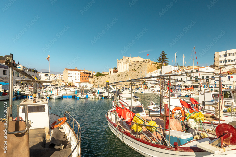 Wall mural port of ciutadella, menorca, picturesque fishing boats and old town, balearic islands, spain