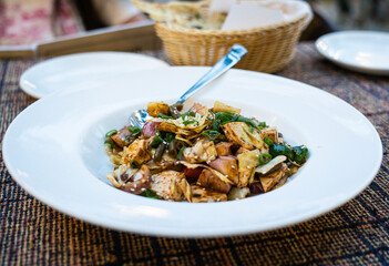 Salad with tofu in a white plate. High quality photo