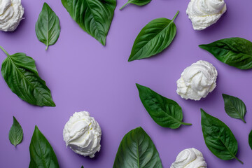 Fresh Basil Leaves and Whipped Cream Dollops on a Purple Background