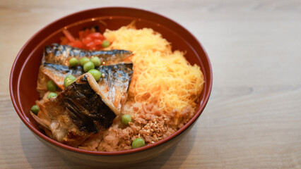 traditional Japanese food with Asian dishes on the table. A traditional Japanese breakfast with rice, fish, and vegetables on the table in a restaurant in Japan. A close-up photo of different dishes f