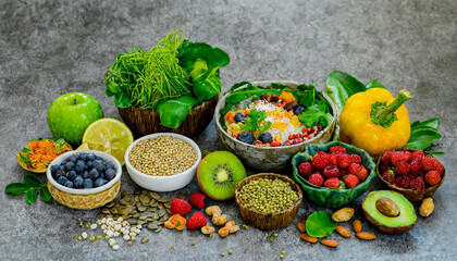 Health food for fitness concept with fruit, vegetables, pulses, herbs, spices, nuts, grains and pulses. High in anthocyanins, antioxidants, smart carbohydrates, omega 3, minerals and vitamins