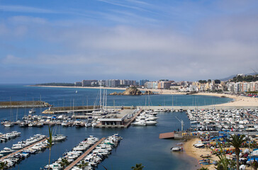 View of the city and embankment on the summer day. Blanes. Spain.