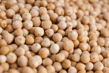 Uncooked dried legume chickpeas or garbanzo bean as background. Vegetarian super food. Healthy eating and dietary. Indian, Mediterranean and Middle Eastern cuisine.