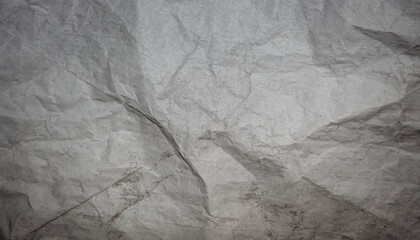 black crumpled paper texture blank dark background with creases